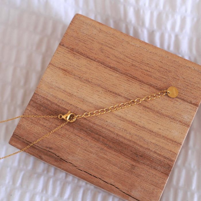 Halskette mit Klee-Anhänger aus weißem Perlmutt & Edelstahl